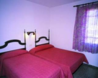 Book La Isla Hostal online